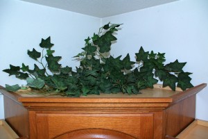 Simple Tips For Decorating Your Cabinet Tops -Add vine for depth